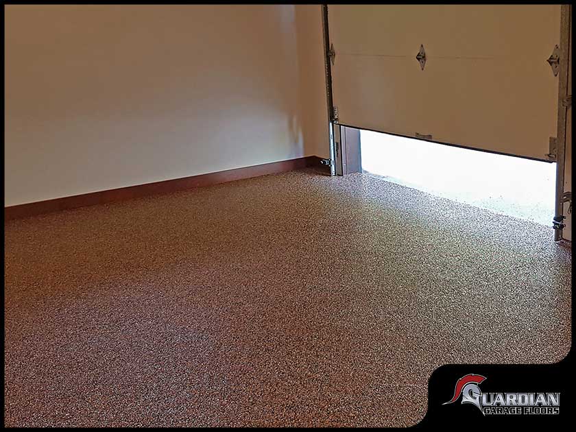 bare garage floor with polyaspartic floor coating