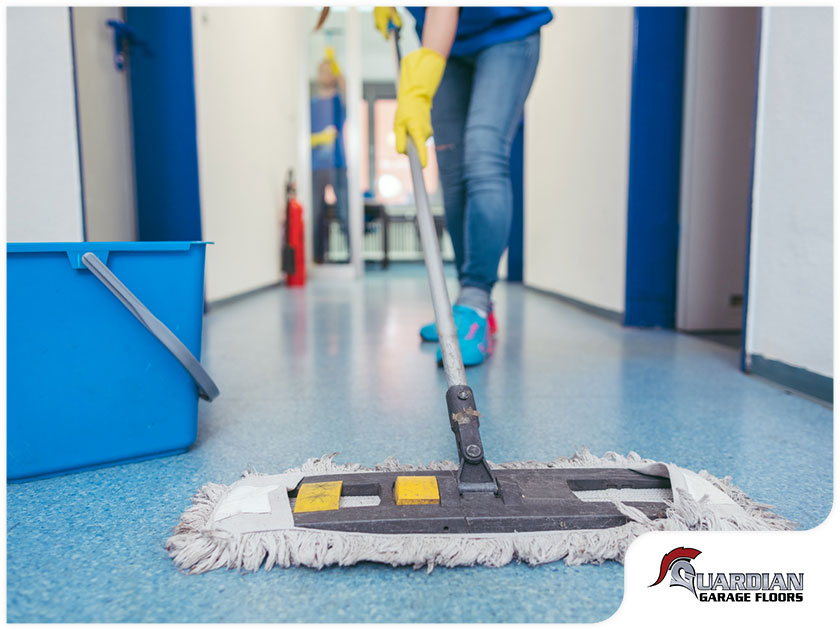 Cleaner using mop on polyaspartic-coated flooring